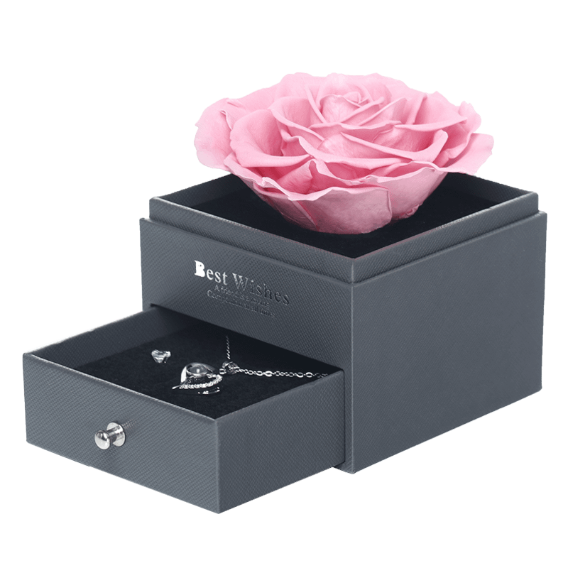 single pink rose in jewelry box